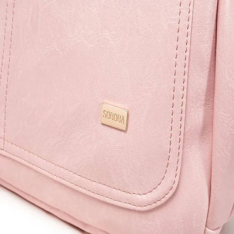 Sac à dos à langer effet cuir rose